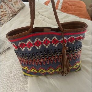 Tory Burch chambray embroideries tote with braided leather straps.